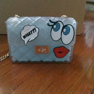 Purse, blue, plastic casing, rubber decals, gold chain strap